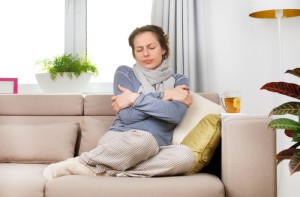 cold woman on couch