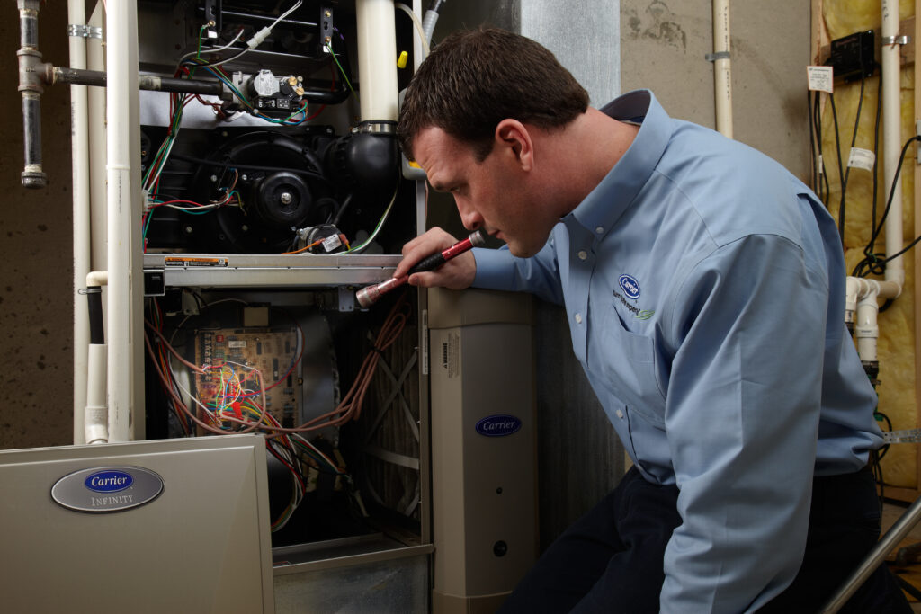 tech performing furnace maintenance